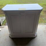 White counter with brass coin mechanism