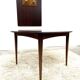 Danish round dining table in rosewood – 1950s design with butterfly extension.