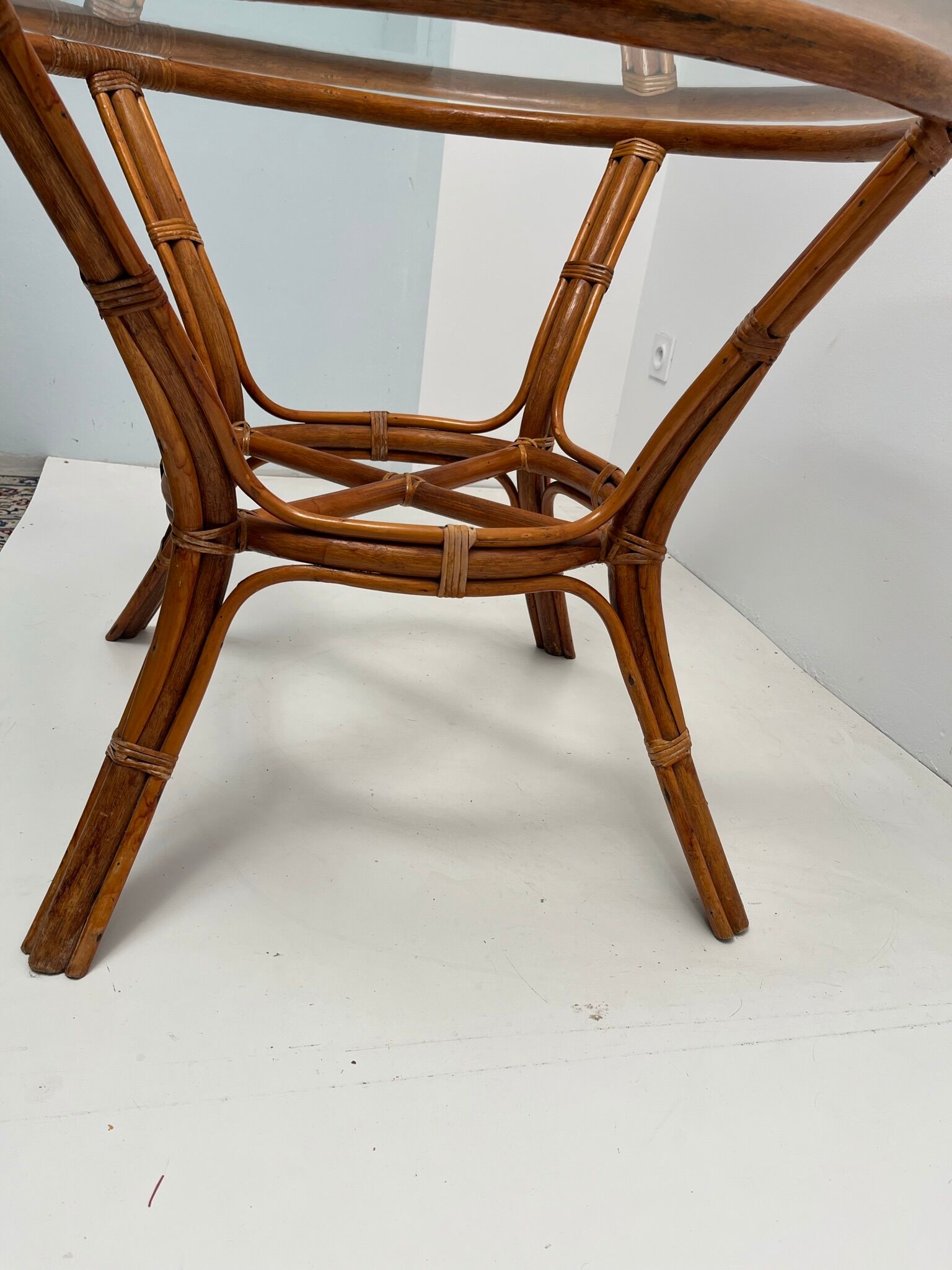 Vintage glass top rattan dining table