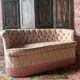 Small vintage 2-seater sofa from the 70s in Hollywood Regency style, satin pink.