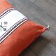 Moroccan Berber cushion in orange and white.