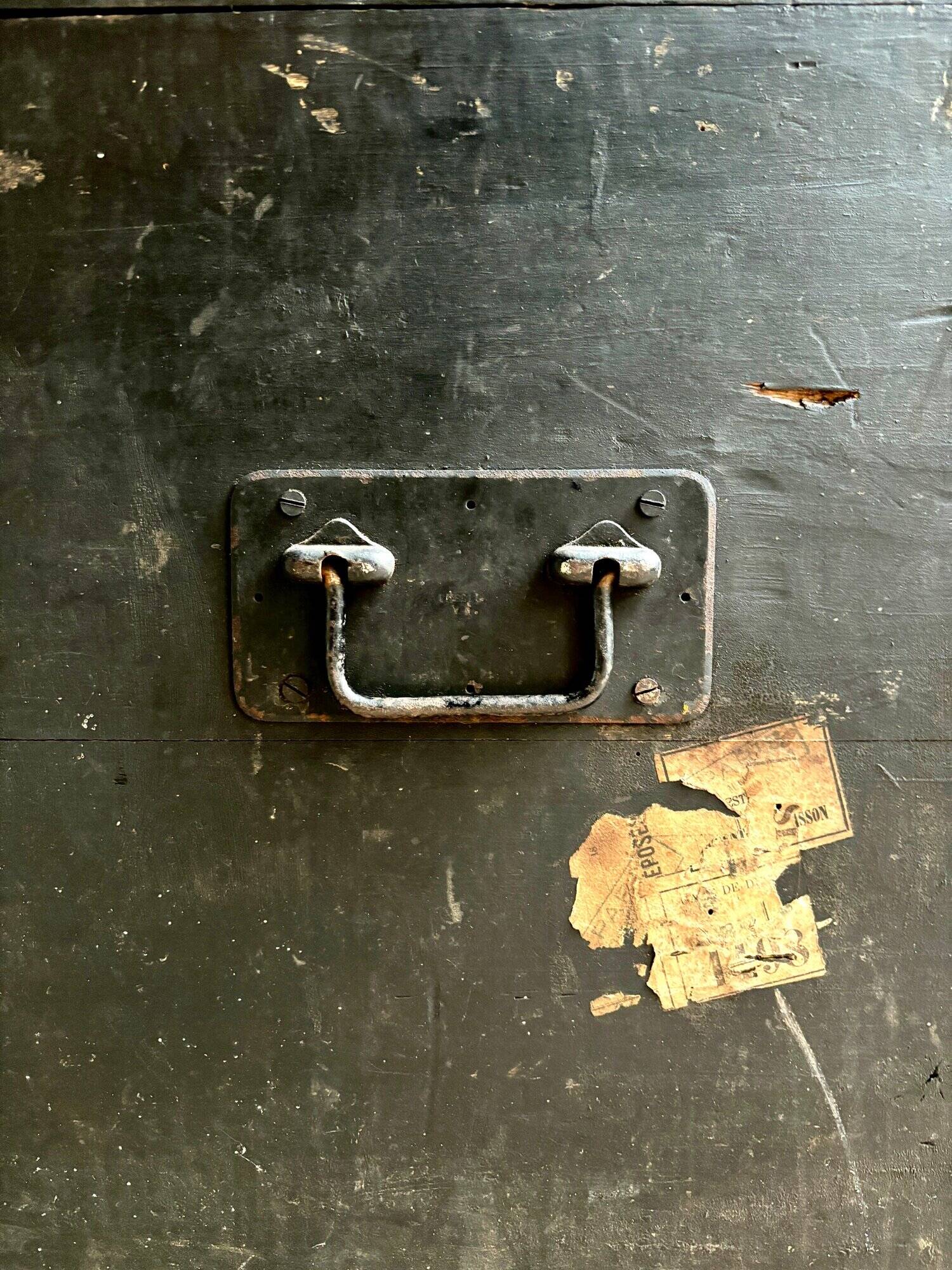 Trunk, black wooden chest and wallpaper