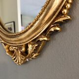 Oval gilded mirror baroque style