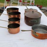 Lots of tinned copper kitchen utensils