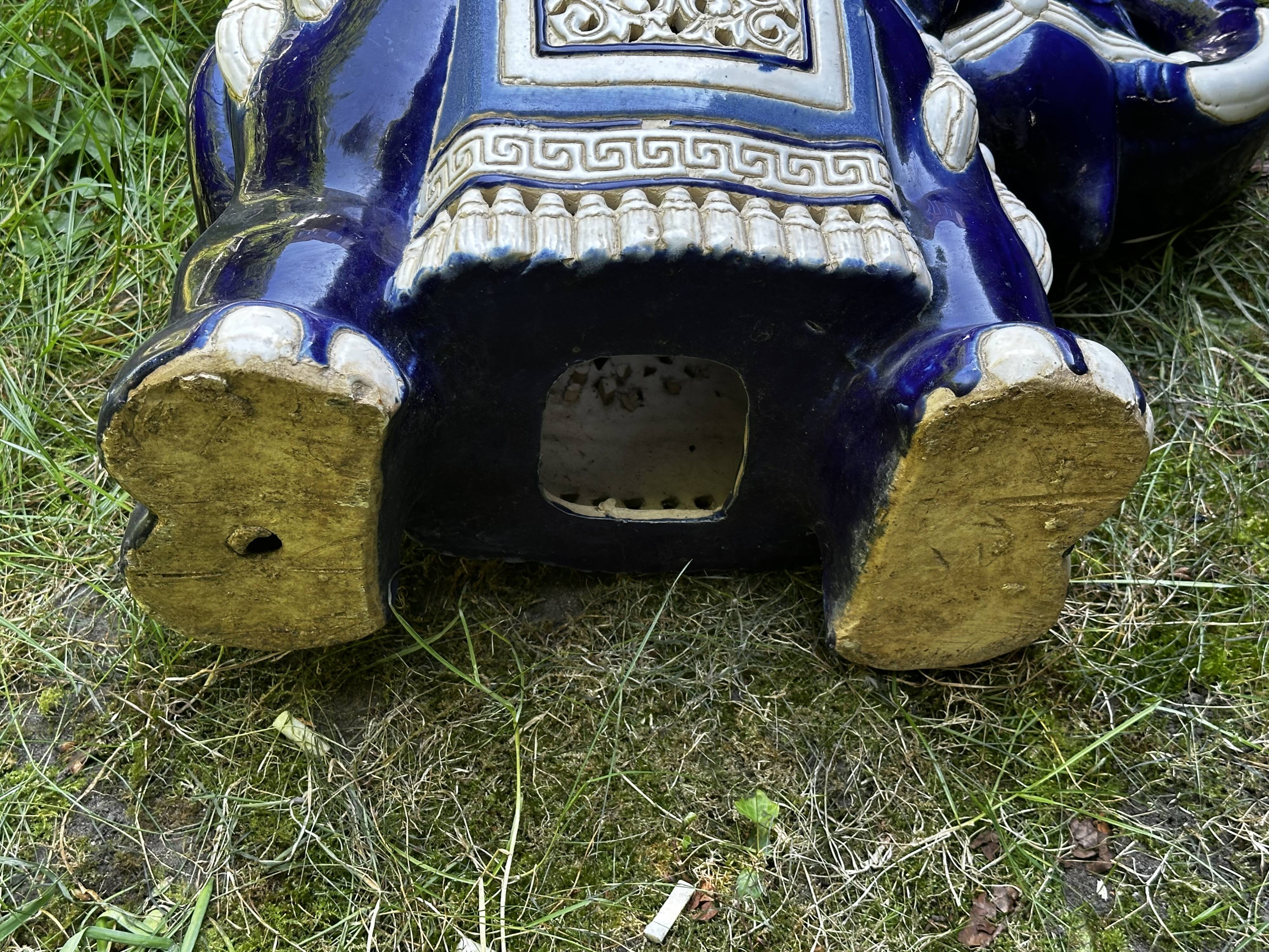 Elephant stool in glazed ceramic in cobalt blue and ivory colors