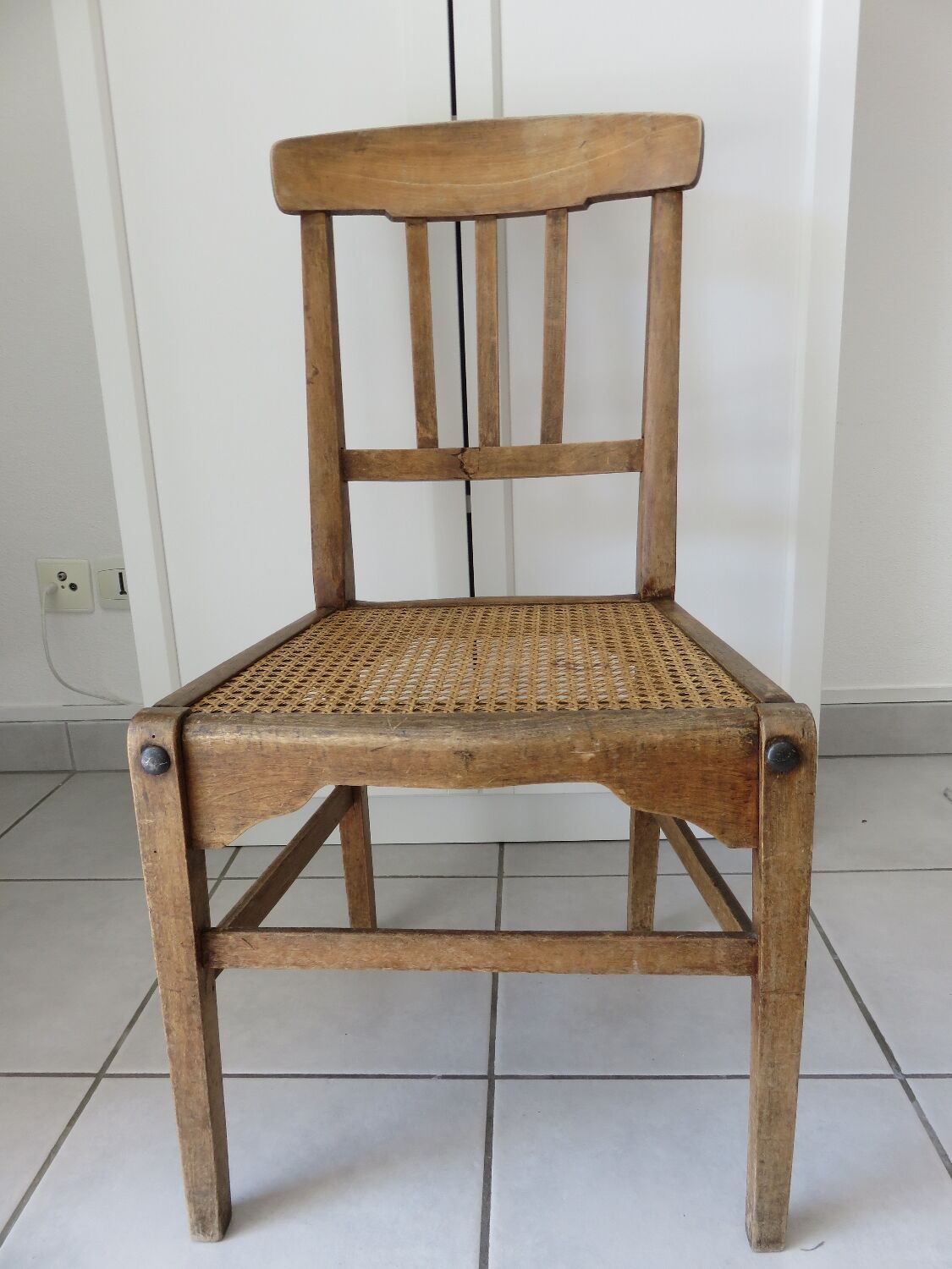 Antique solid wood chair with caning, country house style.