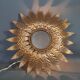 Wall lamp forming sun in gilded brass and with a mirror. Vintage 50s.