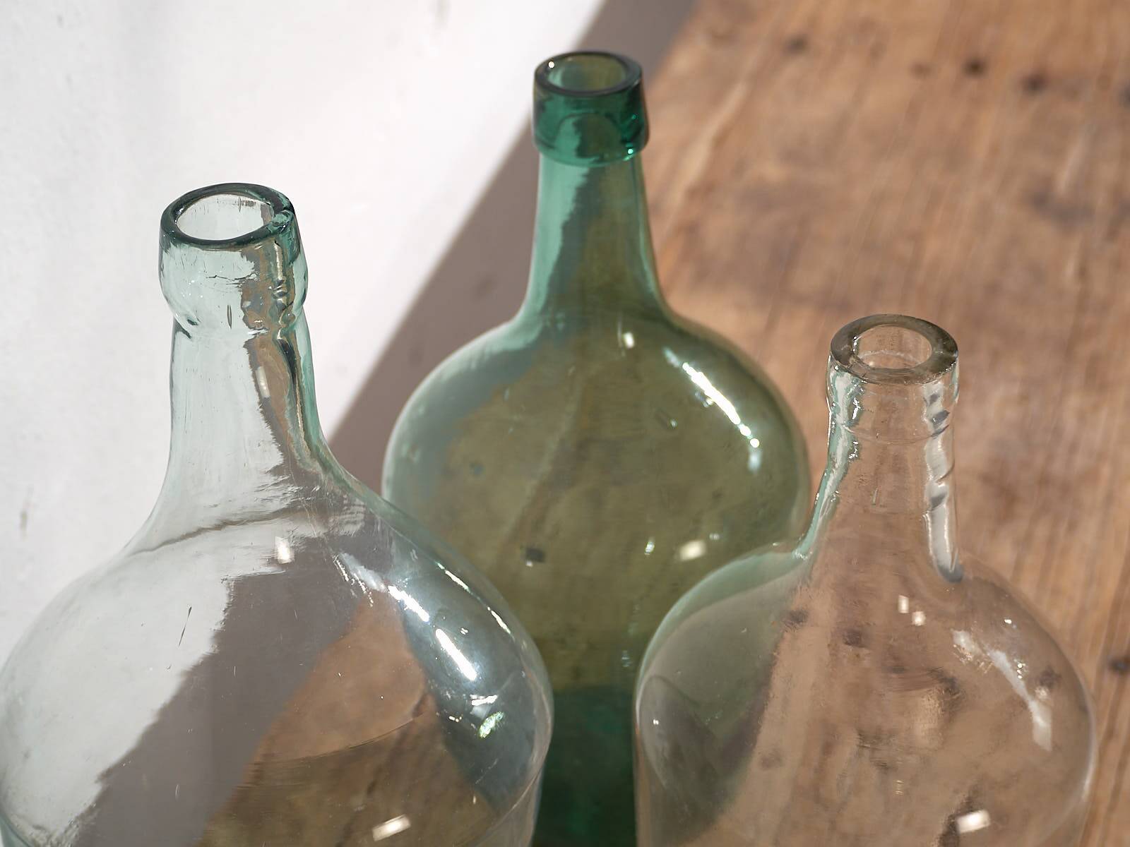 Antique colored demijohns (c.1920). Set of 3 pieces