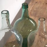 Antique colored demijohns (c.1920). Set of 3 pieces