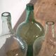 Antique colored demijohns (c.1920). Set of 3 pieces
