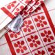 White and red embroidered tablecloth and eight matching napkins, 200x150cm