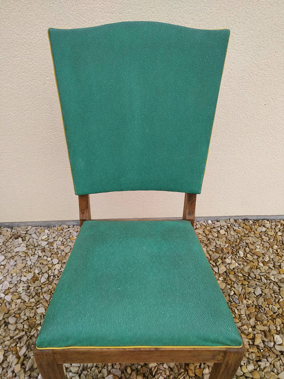 Skai vintage and sitting Chair wood and springs.
