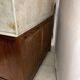 Antique wood and marble kitchen sideboard with carved backsplash