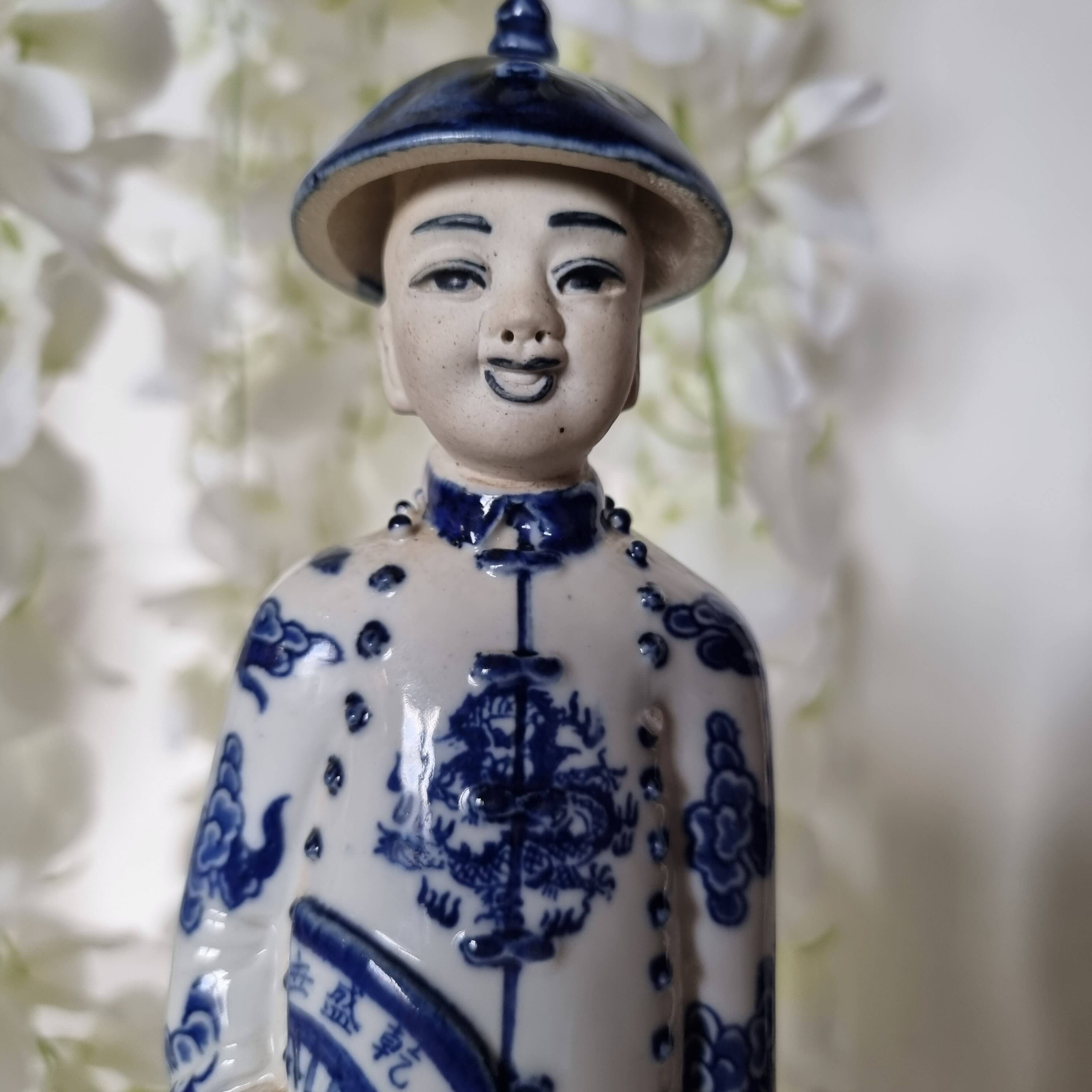 Pair of vintage Chinese blue and white porcelain figurines depicting