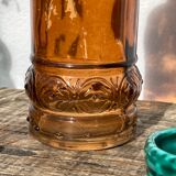 Vintage amber bottle in patterned brown glass
