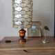 Table lamp with wooden base and mother-of-pearl fish and brass lampshade