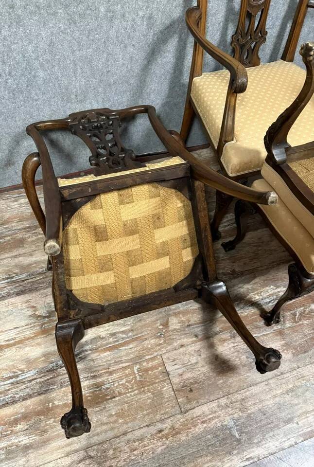 Pair of English armchairs with mahogany footrests circa 1850