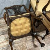 Pair of English armchairs with mahogany footrests circa 1850