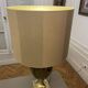 Bronze table lamp with a golden shade.