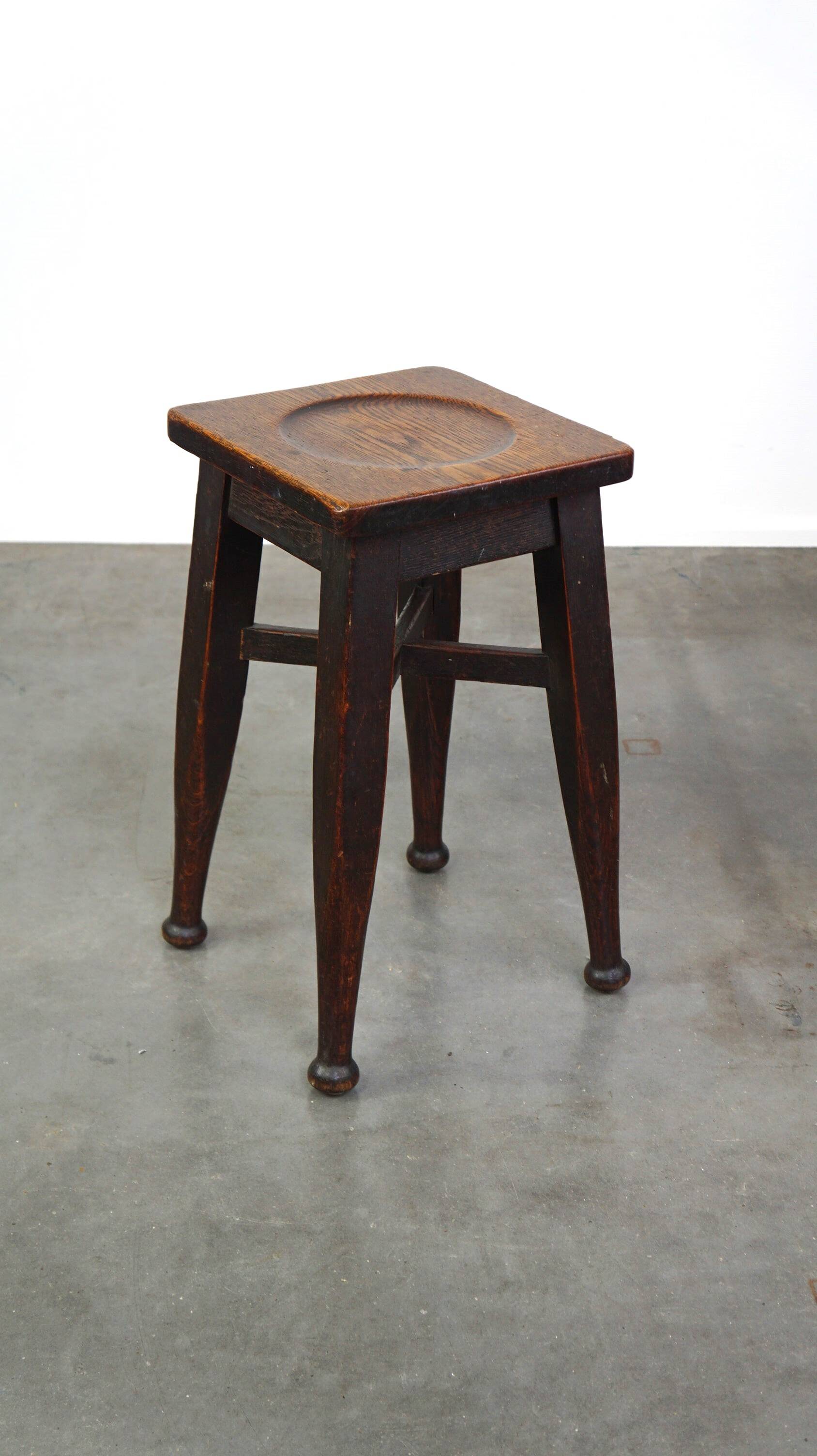 Antique English solid oak stool with a touch of art nouveau style