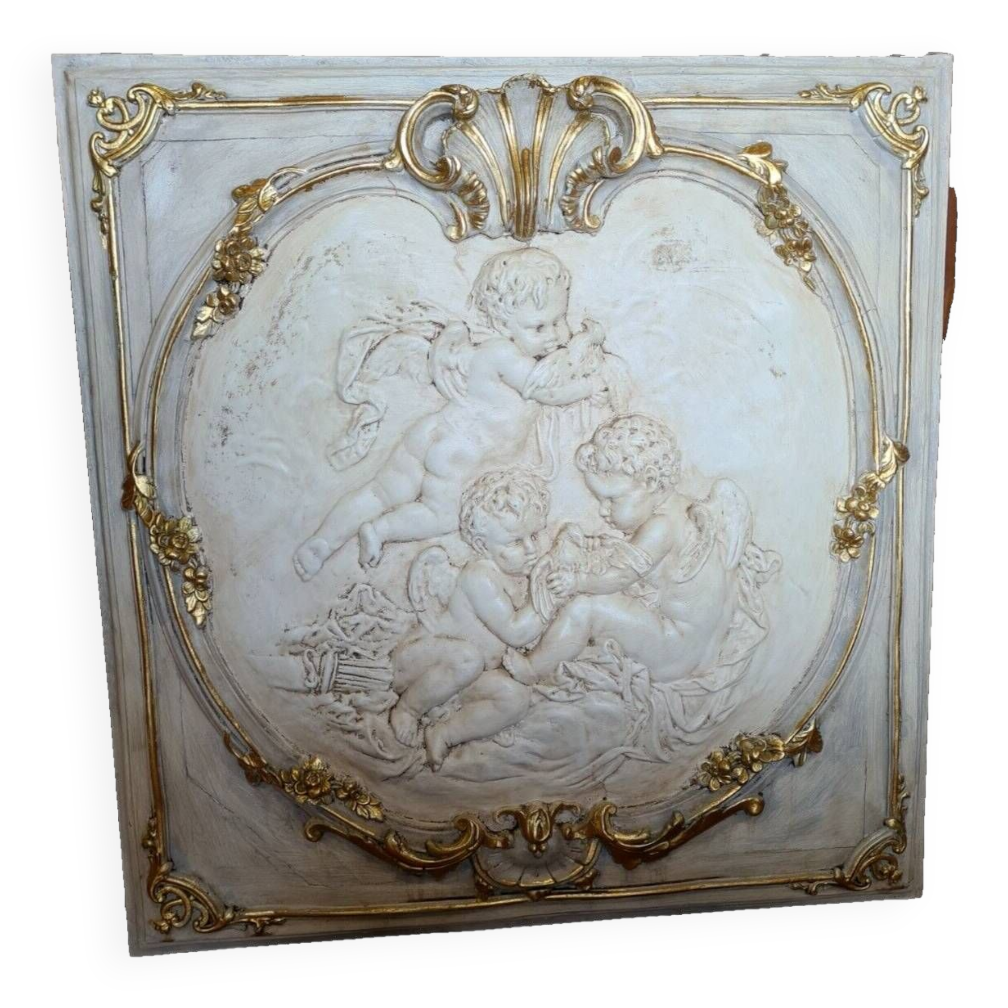 wall panel with angels in stucco and weathered wood