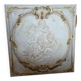 wall panel with angels in stucco and weathered wood