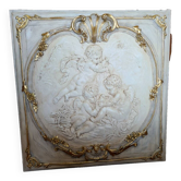 wall panel with angels in stucco and weathered wood
