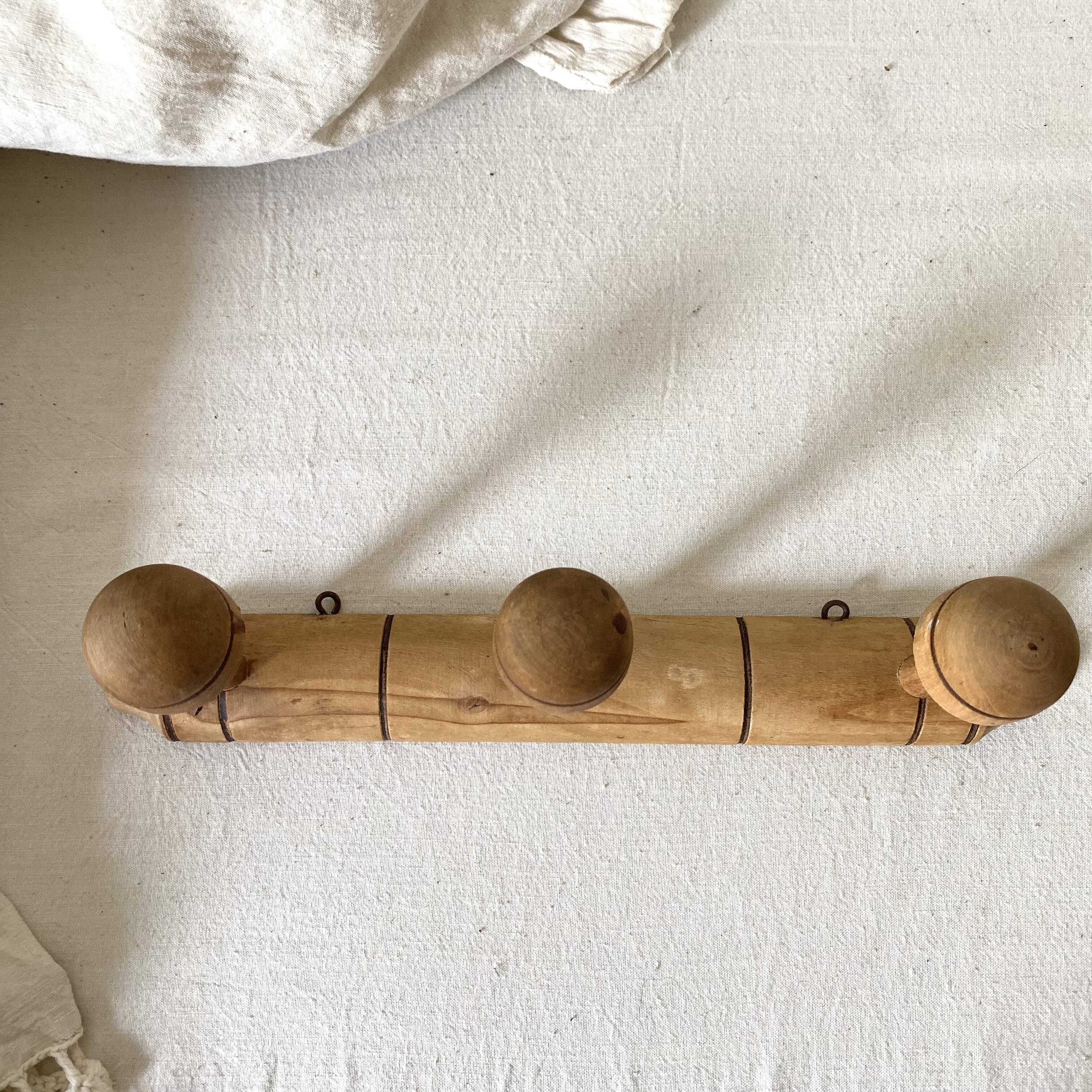 Turned wooden wall coat rack with 3 hooks