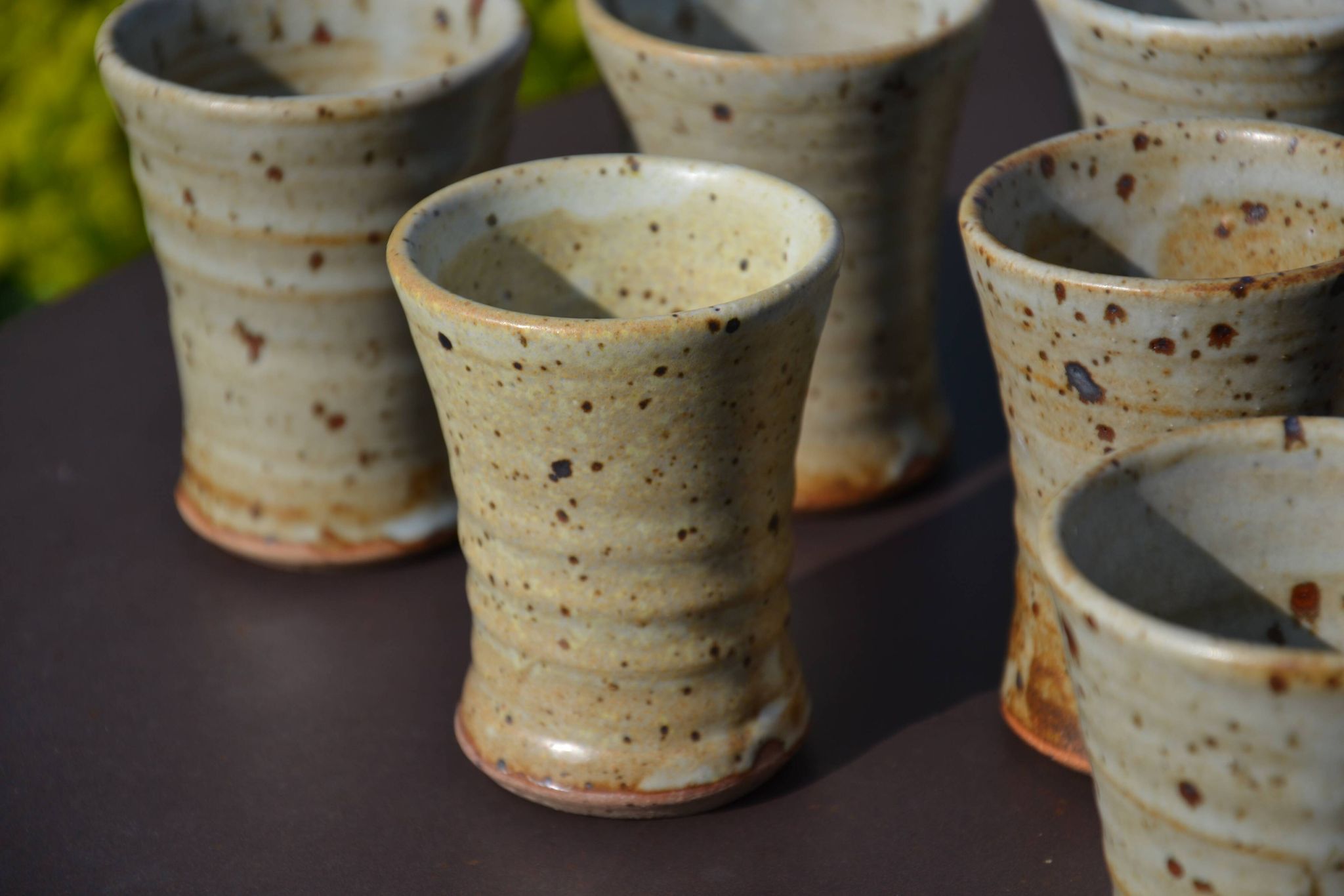 8 stoneware cups/mugs by Gustave Tiffoche
