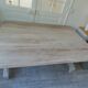 Console table in walnut with drop-leaf extensions, grey patinated base.