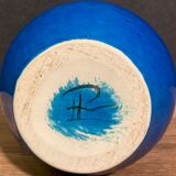Signed vase in turquoise blue earthenware