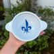 Set of seven earthenware bowls, Quimper, lily flower decoration.