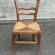 Period rustic chair with a straw seat