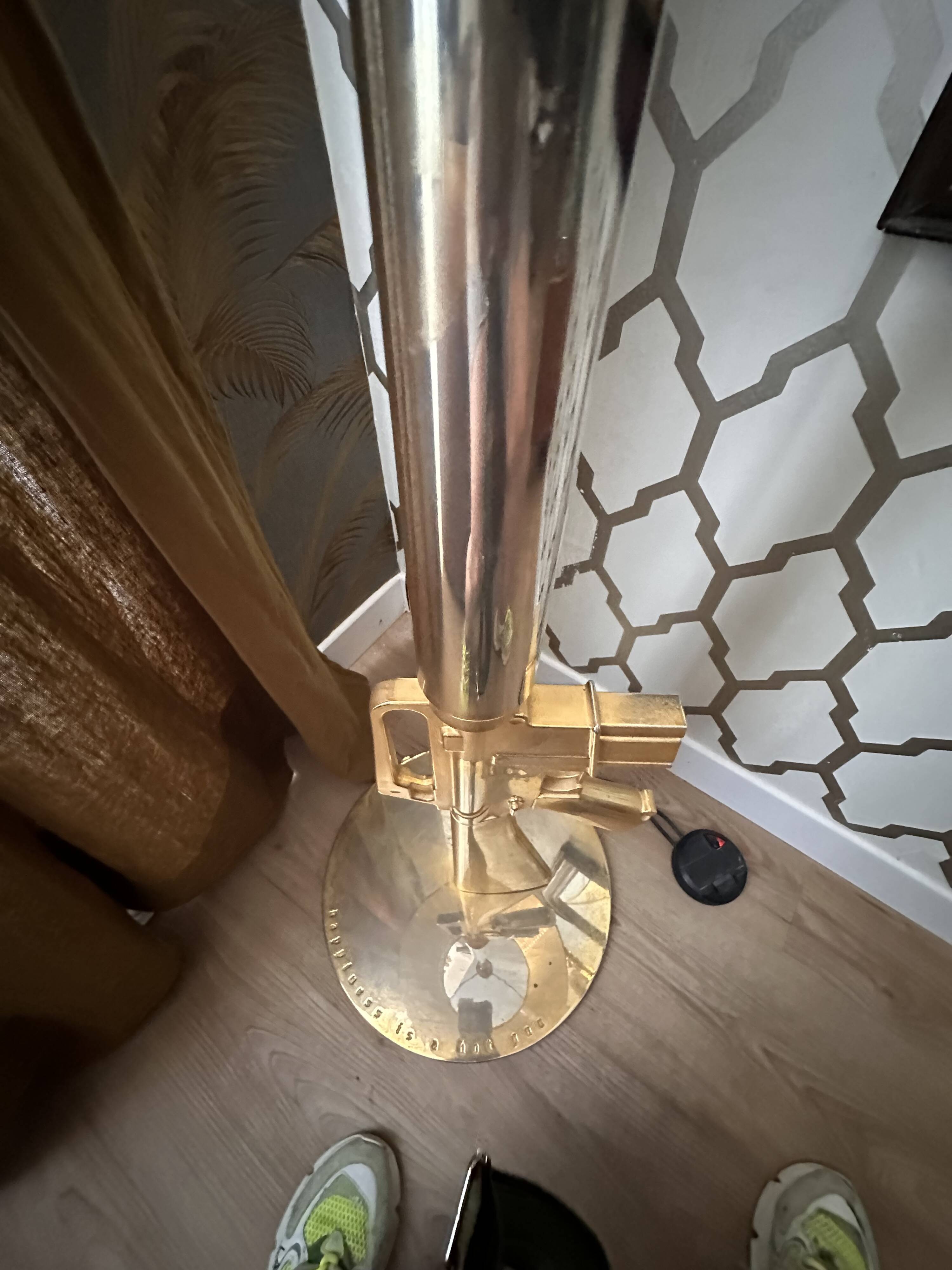 "Lounge Gun" floor lamp by FLOS by Philippe Starck – Gold