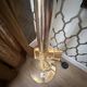 "Lounge Gun" floor lamp by FLOS by Philippe Starck – Gold