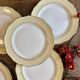 Set of 6 vintage white dinner plates with yellow and gold trim.