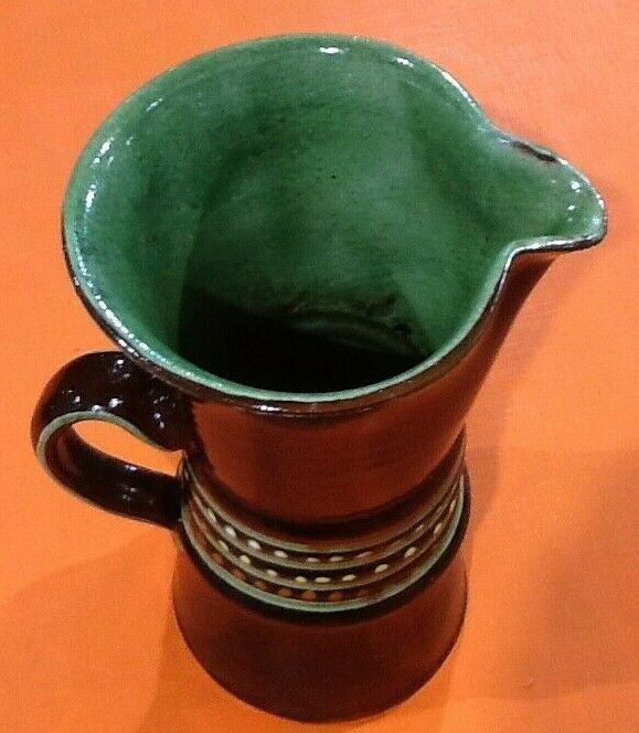 Glazed terracotta pitcher decorated with beaded friezes