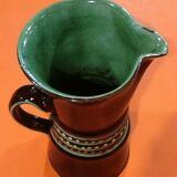 Glazed terracotta pitcher decorated with beaded friezes
