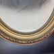 Oval medallion frame in wood and gilded stucco, Louis XVI style knot
