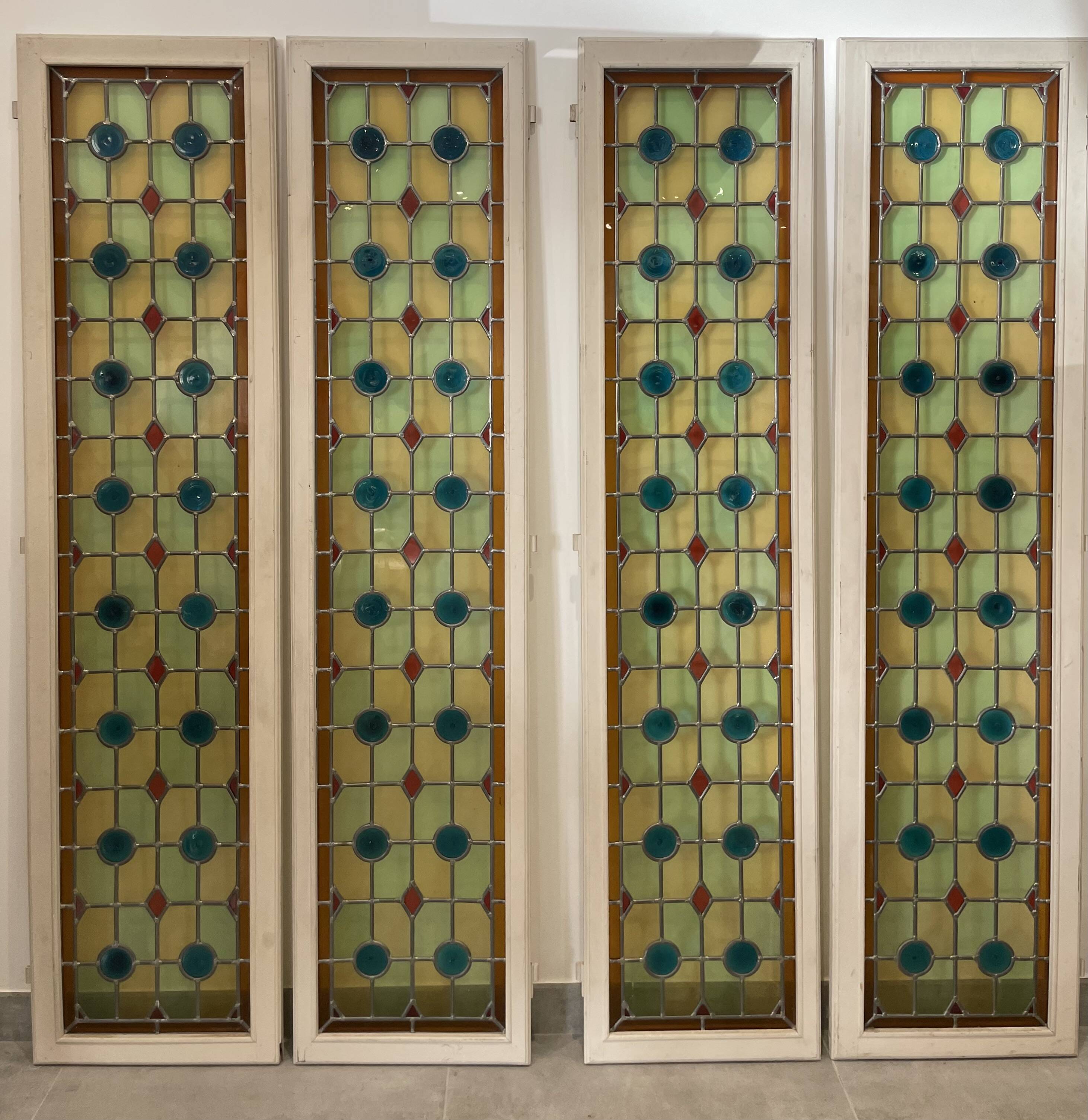 4 vintage faux stained glass panels that can form a screen or a partition