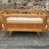 Wooden and rattan baby bed