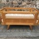 Wooden and rattan baby bed