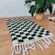 Small Berber rug with green tiles.