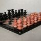 Small chessboard in coral marble and black marble - Italy - Second half of the twentieth century