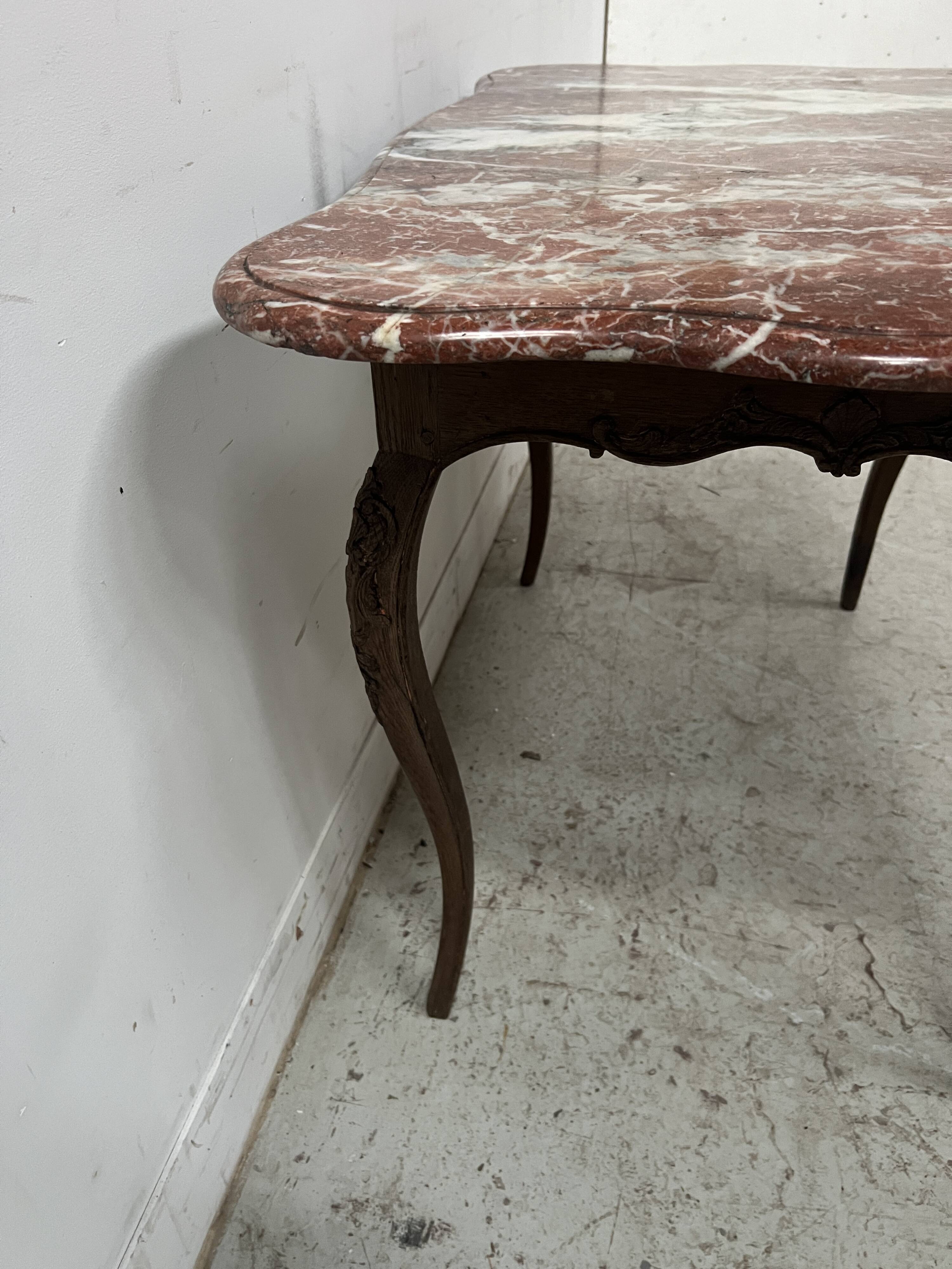 Louis XV mid-table in oak and marble, 18th century.