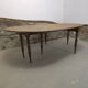 Half-moon extendable oak table for 2 to 8 people.