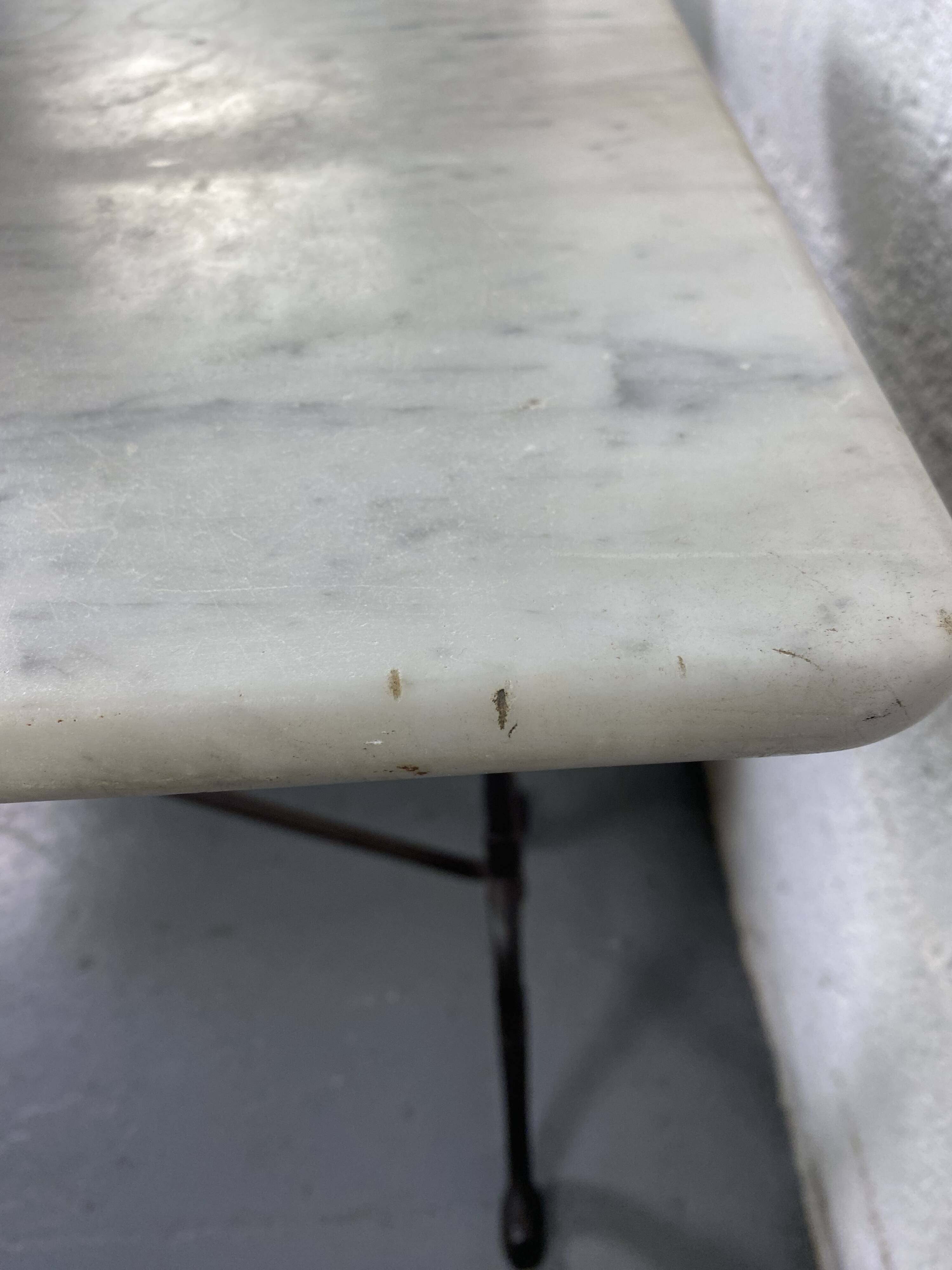Set of two bistro tables in marble and wrought iron