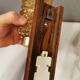 wall lights in rosewood look, with amber coloured glass and brass details.