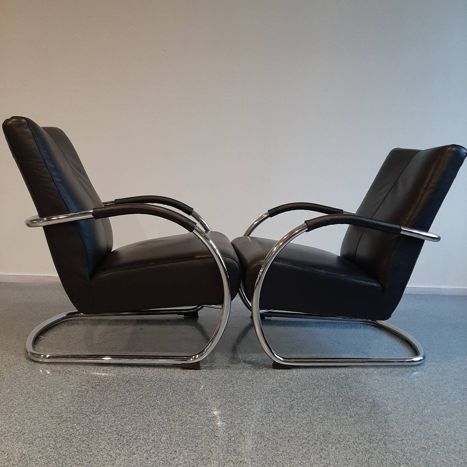 Pair of tubular armchairs