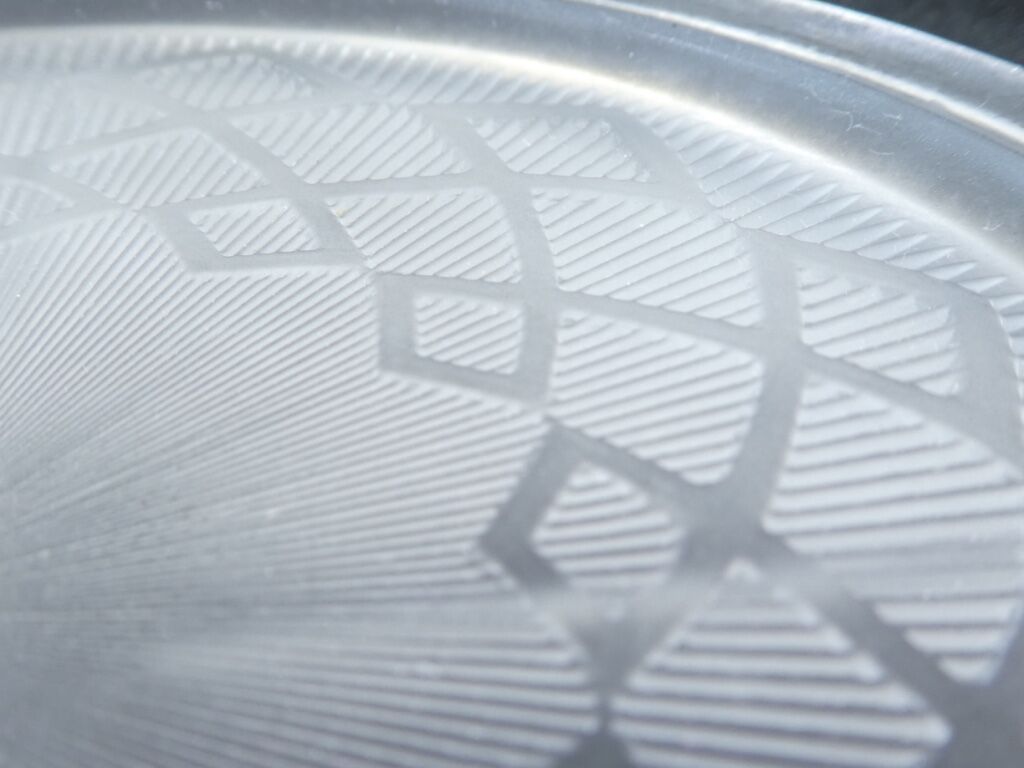 Pair of pressed moulded glass bottles mats